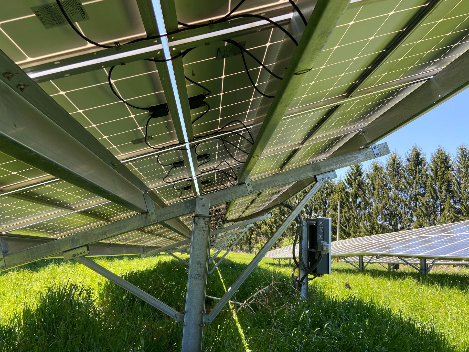 Solar panels are wired together and the current generated passes through an inverter (box on pole on right). Credit: Penn State MCOR